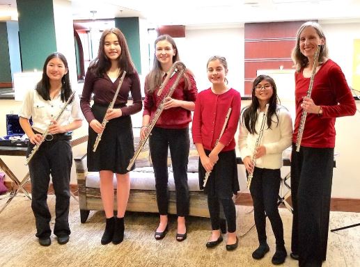 Melissa with students at retirement community holiday outreach concert